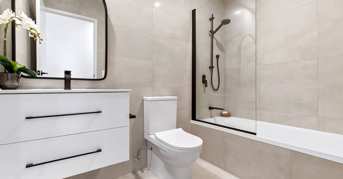 bathroom-permit-albany-or-2 Modern bathroom remodel featuring floating vanity, vessel sink, glass shower, and neutral tile flooring