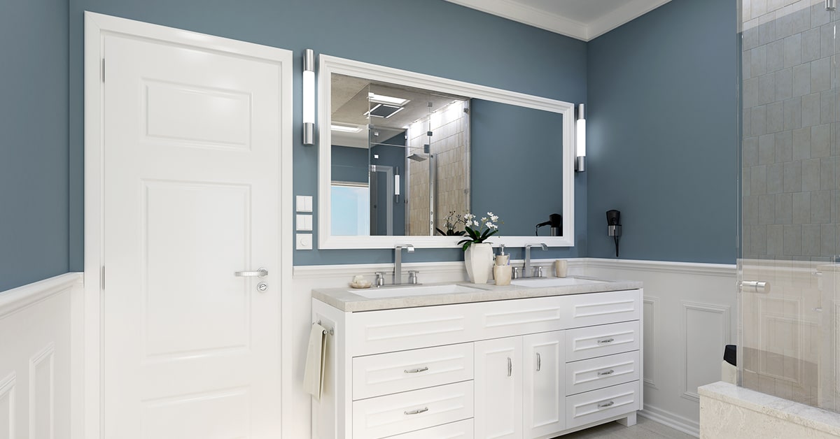 Luxury bathroom remodel featuring a freestanding tub, glass shower enclosure, custom wood cabinetry, and modern marble finishes